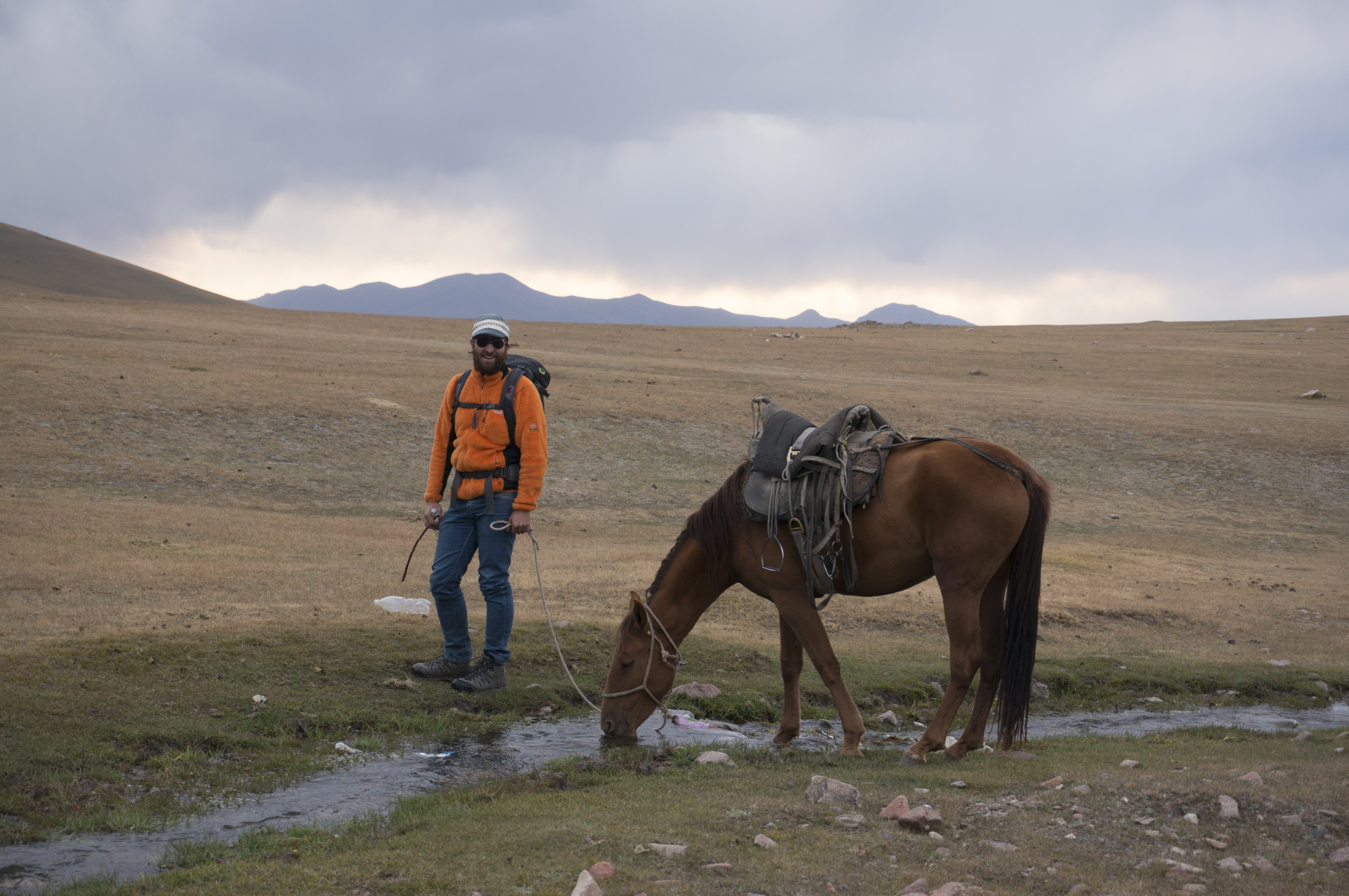 Tourist with horse near Song Kul lac