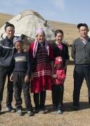 Kyrgyz family in front of a yurt near Song Kul lake